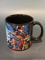Front and side views of a ceramic mug featuring Guardians of the Galaxy characters Star-Lord and Rocket Raccoon on one side.