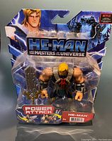 Photo of He-Man action figure in Power Attack packaging with sword accessory
