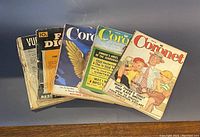Seven vintage magazines fanned out showing colorful front covers from the 1950s, including multiple Coronet issues, True Detective, and Vu.