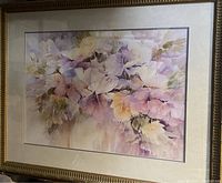 Framed floral painting with pastel colors dominated by purples, pinks, and greens, signed by Ann Hunter.