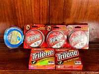 Photo showing all six packs of fishing line including five Berkley Trilene XL packs and one Radley pack.
