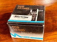 Closed original box showing Ryobi 357MG branding and Berkley sticker