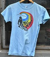 Full front view of the light blue Hanes t-shirt showing the Ski Killington skier graphic and colorful rainbow arc design.