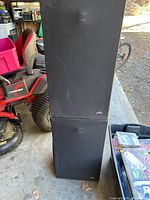 Front view of two black JVC loudspeakers stacked vertically.