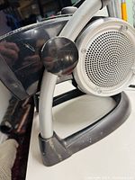 Side view showing the rounded grille front and curved handle base of the Lasko heater.