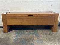 Front view of bench showing front panel and integrated handle