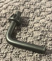 Photo shows a metal chuck key with a toothed gear head and L-shaped handle.