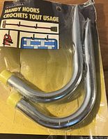 Two metal handy hooks with yellow rubber tips in original packaging labeled 'Durham Handy Hooks'.