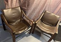 Two chairs angled side by side showing overall shape and condition