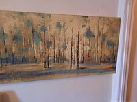Canvas print showing an abstract forest scene with vertical tree shapes and a textured, muted color palette.