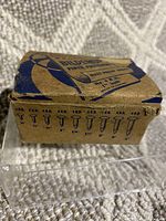 Box of BILDEMUP Paper Fasteners, rust proof brass, vintage packaging with price tag and usage marks.