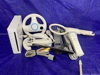 Overview of console, remotes, Nunchuks, peripherals, sensor bar and AV cable