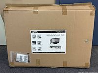 Sealed cardboard box packaging with Prime Pets label showing product images and features of the 42" Extra Large Dog Crate with Divider.