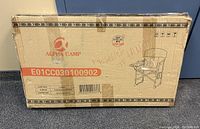 Photo of original shipping box showing Alpha Camp branding and product code E01CC030100902.