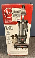 Original retail box for Hoover WindTunnel Tangle Guard upright vacuum showing front view and branding.