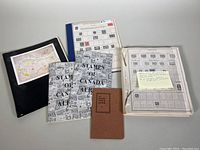 Photograph of the complete lot showing albums, stock books and folders for Canadian stamps and worldwide stamps.