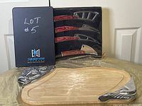 Overview of the wooden cutting board with metal cow detail and cheese cutlery set in packaging and out of packaging