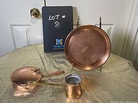 Complete set photo with copper plate on stand, copper bed warmer, and small copper milk warmer with brass handle.