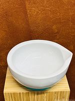 Top and side view of the white ceramic soup bowl featuring a pour spout.