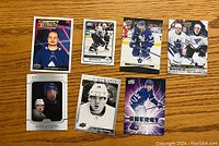 Front view of 7 Auston Matthews hockey cards showing colorful and action shots