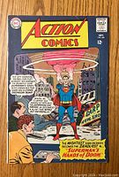 Front cover of Action Comics #328 featuring Superman lifting a flying saucer in a city scene