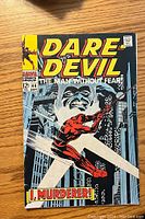 Front cover of Daredevil comic book issue #44 showing Daredevil in red costume swinging across city buildings with night sky background. The cover includes issue number, price, and publication date information.