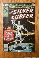 Front cover of the Marvel Comics Group Fantasy Masterpieces Starring The Silver Surfer #1 comic book. Shows The Silver Surfer in cosmic background with text 'The Origin of the Silver Surfer!'.