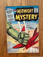 Front cover of Midnight Mystery comic #7 showing colorful airplane aerial battle and promotional text.