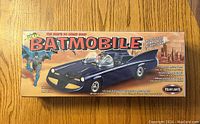 Front of the sealed box showing the Batmobile model illustration and branding.