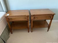 Pair of nightstands side by side from front at slight angle