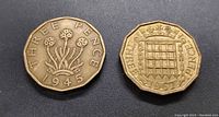 Obverse and reverse of 1945 and 1962 UK Threepence coins showing design and year.