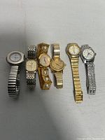 All six ladies watches shown in single row, varying styles and tones, confirming lot contents.