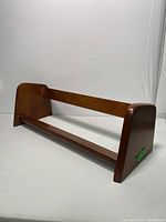 Side angle showing walnut wood grain and structure of book stand
