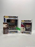 Front view of two boxed Funko POP figures from Harry Potter series: Rubeus Hagrid (#07) and Albus Dumbledore (#04).