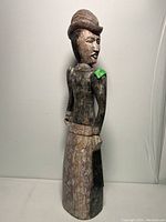 Full view of the large Victorian lady wooden sculpture showing side and back details.