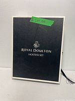 Closed black box with Royal Doulton logo and text 'Hostess Set' on lid, showing original packaging.