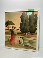 Framed watercolor artwork showing a woman with a dog next to a pond and tall trees, in soft warm tones, labeled Lot 73