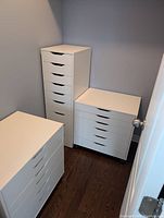 Corner view showing one tall Alex drawer unit alongside two short units on castors