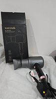 Wavytalk hair dryer and its original box showing product outline and model number.