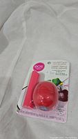 Photo of unopened EOS Coconut Milk and Cherry Vanilla lip balm pack showing both products in pink packaging.
