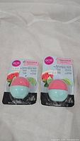 Two new eos lip balms in sealed blister packaging, Watermelon Lime scent.