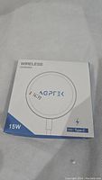 Front view of AGPTEK wireless charger box showing 15W power and Type-C compatibility.