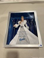Barbie Holiday Visions 2003 doll in original open box with visible shelf wear on box but doll intact and never removed.