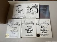 Photo shows six Shel Silverstein books: Falling Up, A Light in the Attic, and three copies of Where the Sidewalk Ends with dust jackets. Books appear in excellent, lightly used condition from a smoke and pet-free home.