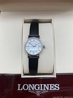 Front view of watch face in original Longines box with branding visible