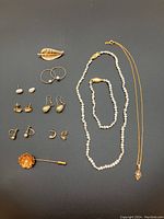 Overview of all jewelry items arranged on black background