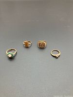 All four 10k gold rings displayed together