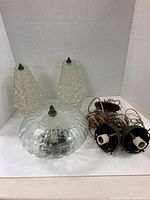 Round ceiling glass light fixture with bubbled textured glass shade, approx. 12 inches diameter, with metal finial on top and mounting hardware visible.