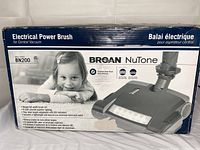 Box of Broan NuTone BN200 electrical power brush for central vacuum showing brand, model, and key features indicating new open box condition.