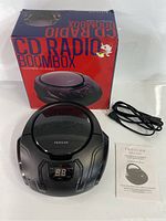 FROSAN portable CD radio boombox with included power cable, user manual, and original box.